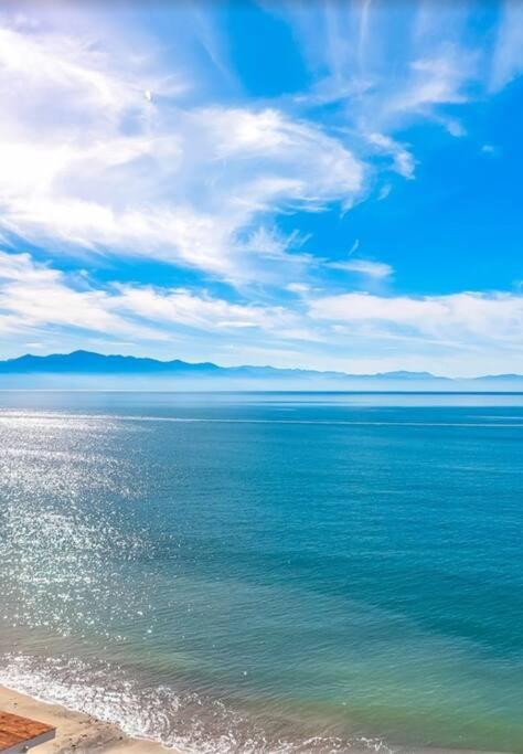 a view of the ocean from the shore of a beach at Oceanfront-Ocean View in Bucerias Casita Oasis Condo - Large Studio in Bucerías