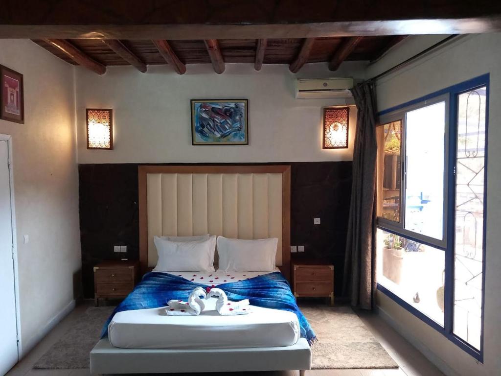 Postel nebo postele na pokoji v ubytování Auberge kasbah tifirte