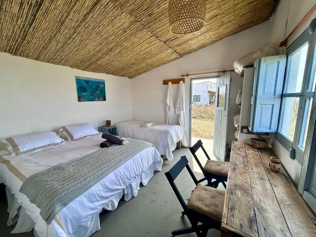 Postel nebo postele na pokoji v ubytování Carmela Suites Cabo Polonio