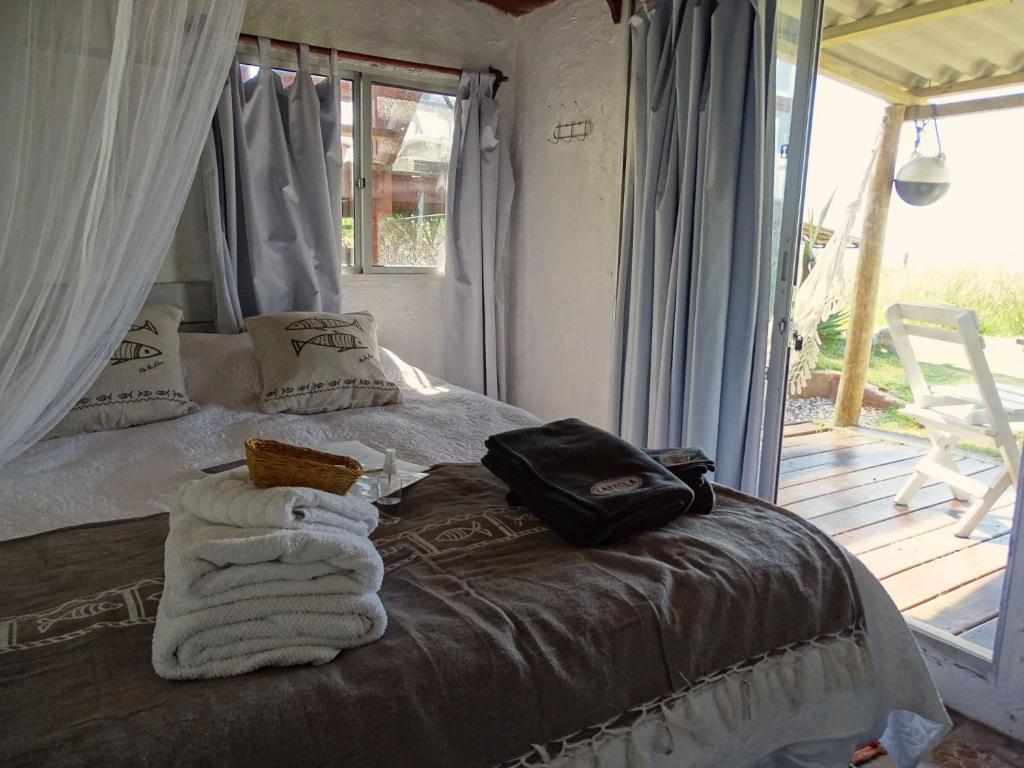 Postel nebo postele na pokoji v ubytování Carmela Suites Cabo Polonio