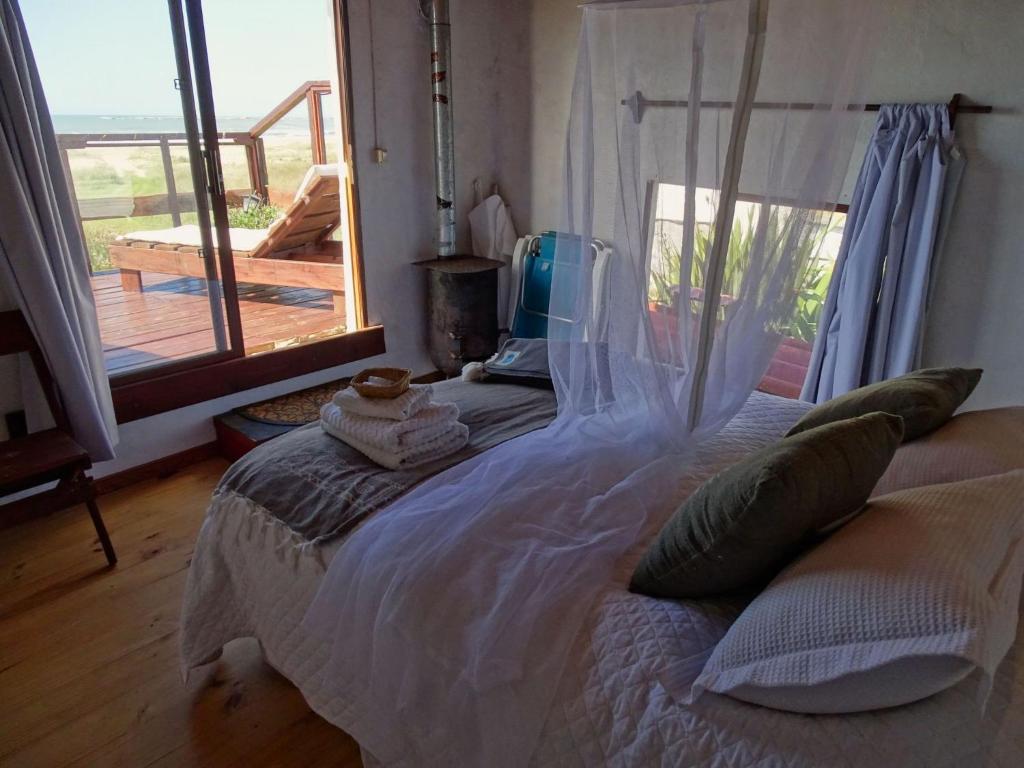 Postel nebo postele na pokoji v ubytování Carmela Suites Cabo Polonio