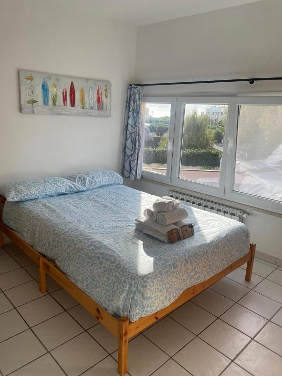 Postel nebo postele na pokoji v ubytování Appartamento due passi dal mare