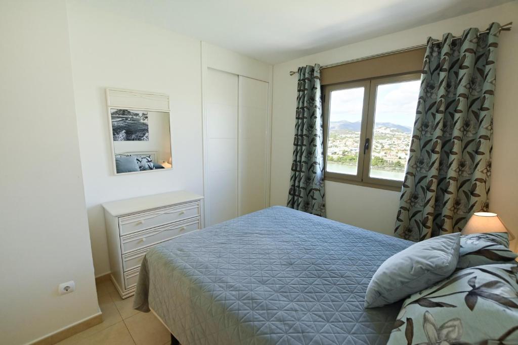 Un pat sau paturi într-o cameră la EDIFICIO LARIMAR