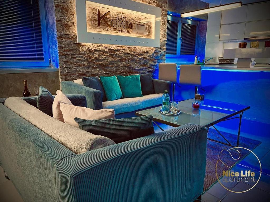 a living room with a couch and a table at NICE LIFE - Luxury apartment in the Old Town. in Bratislava