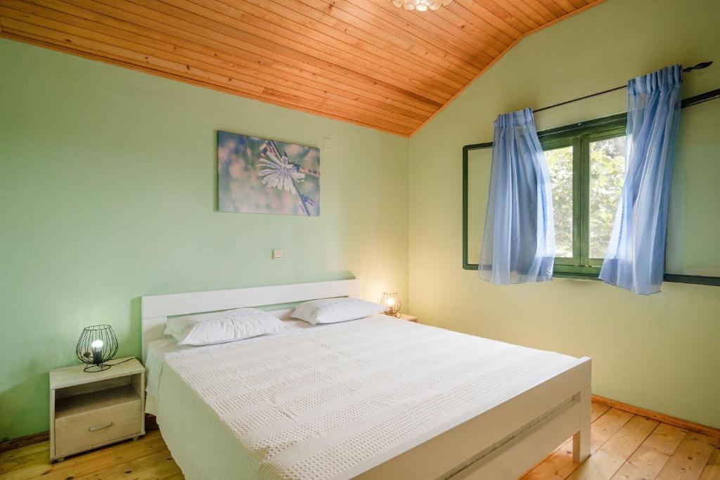 Łóżko lub łóżka w pokoju w obiekcie House Momento