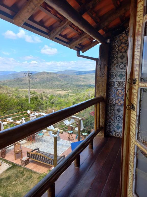 a balcony with a view of the mountains at Pousada Cachoeiras do Cipó in Serra do Cipo
