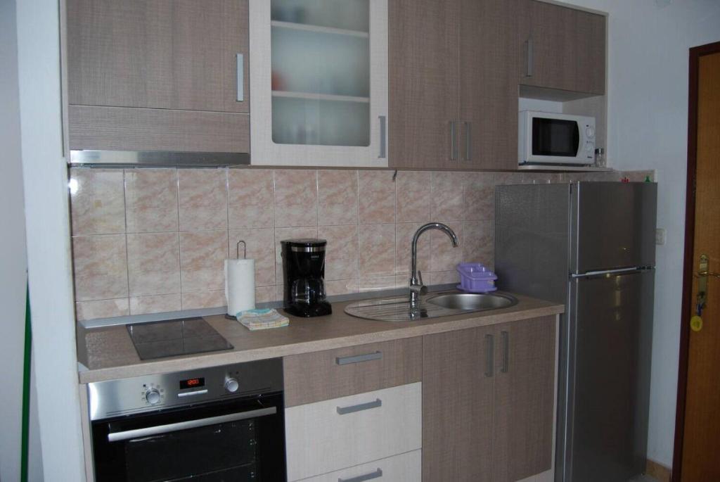 Kuchyň nebo kuchyňský kout v ubytování Apartments Krila