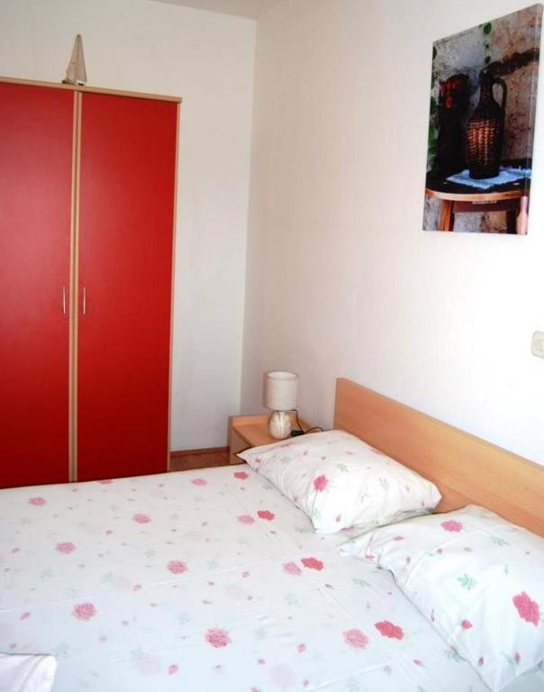 Postel nebo postele na pokoji v ubytování Apartments Krila