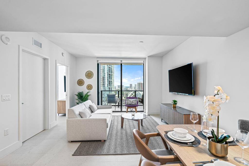a living room with a couch and a table at New Luxury 26th Floor Apartment in the heart of Miami in Miami