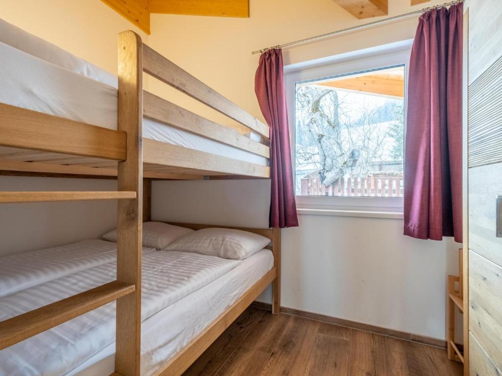 Łóżko lub łóżka w pokoju w obiekcie Adlerblick