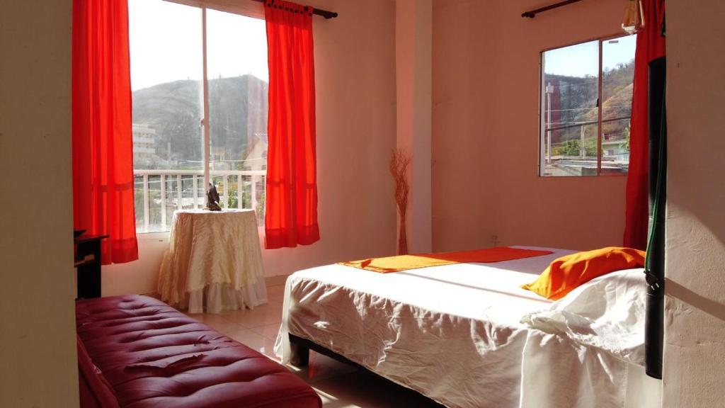 Postel nebo postele na pokoji v ubytování Hotel Taganga Dive Santa Marta