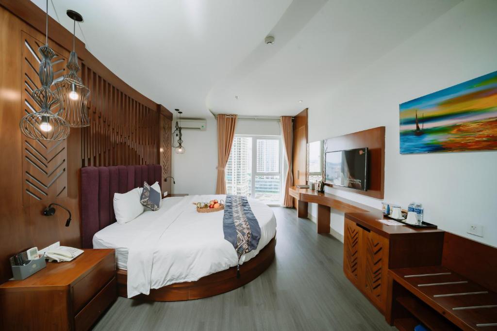 Postel nebo postele na pokoji v ubytování TGT BEACH HOTEL
