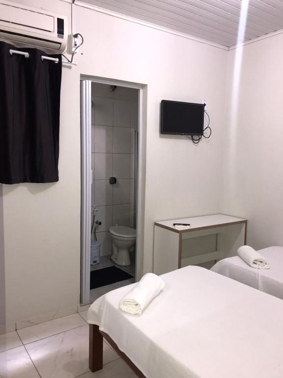 Postel nebo postele na pokoji v ubytování Pousada La Ville