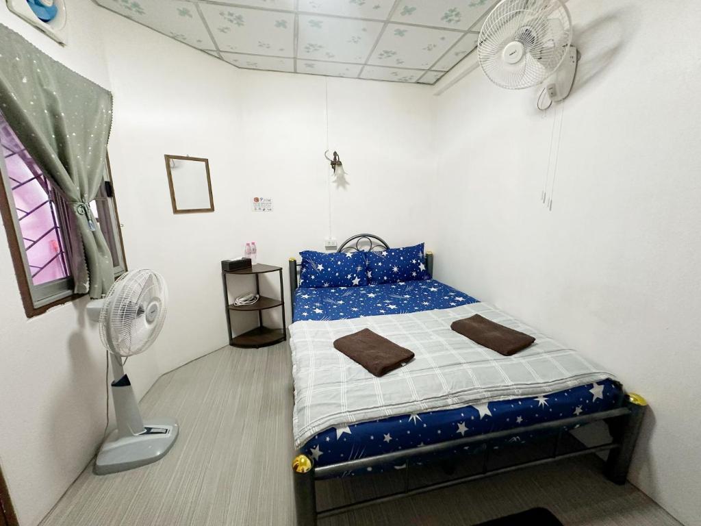 Postel nebo postele na pokoji v ubytování Madam Guesthouse