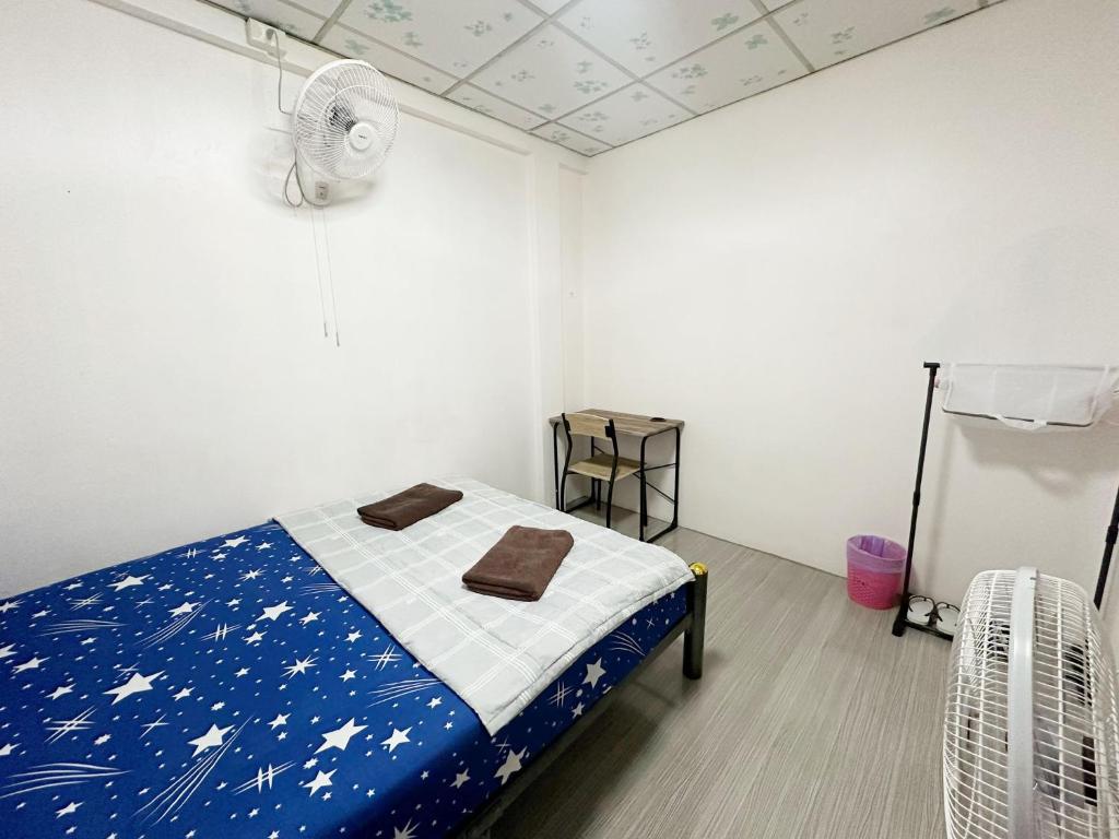 Postel nebo postele na pokoji v ubytování Madam Guesthouse