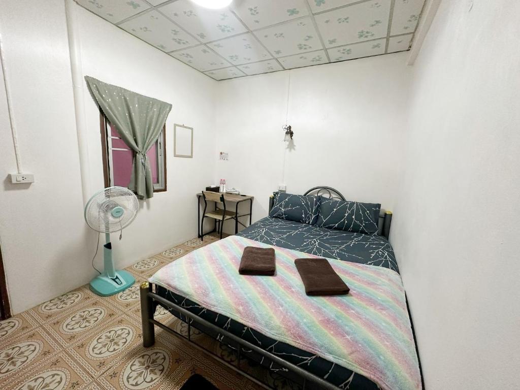 Postel nebo postele na pokoji v ubytování Madam Guesthouse