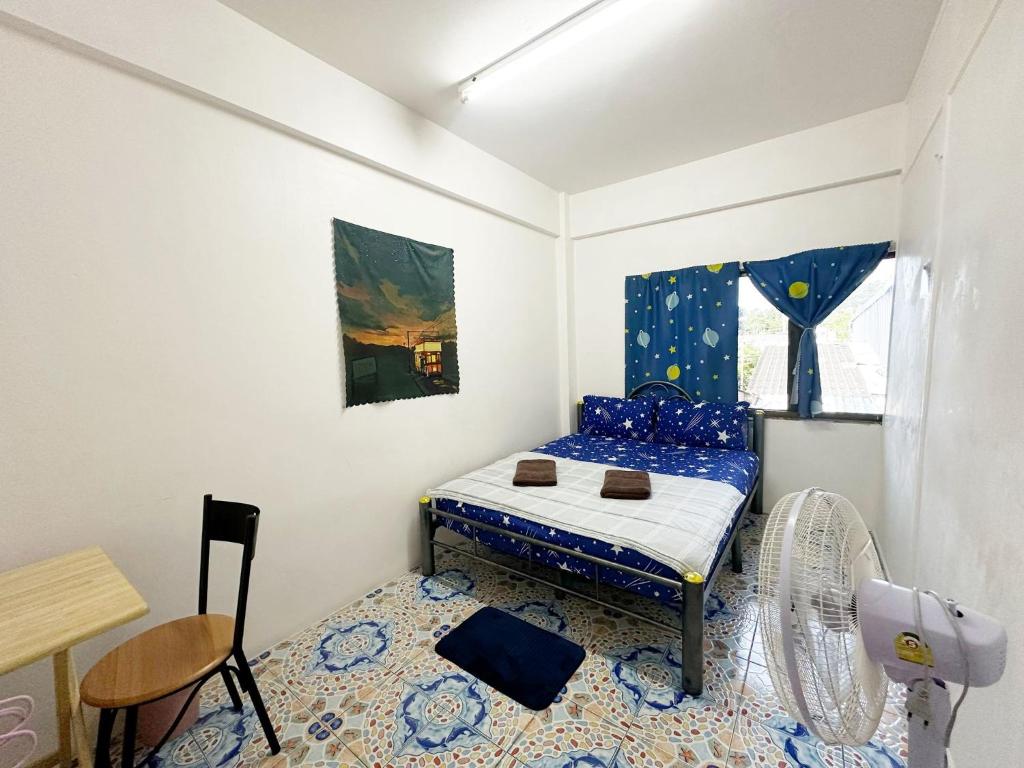 Postel nebo postele na pokoji v ubytování Madam Guesthouse