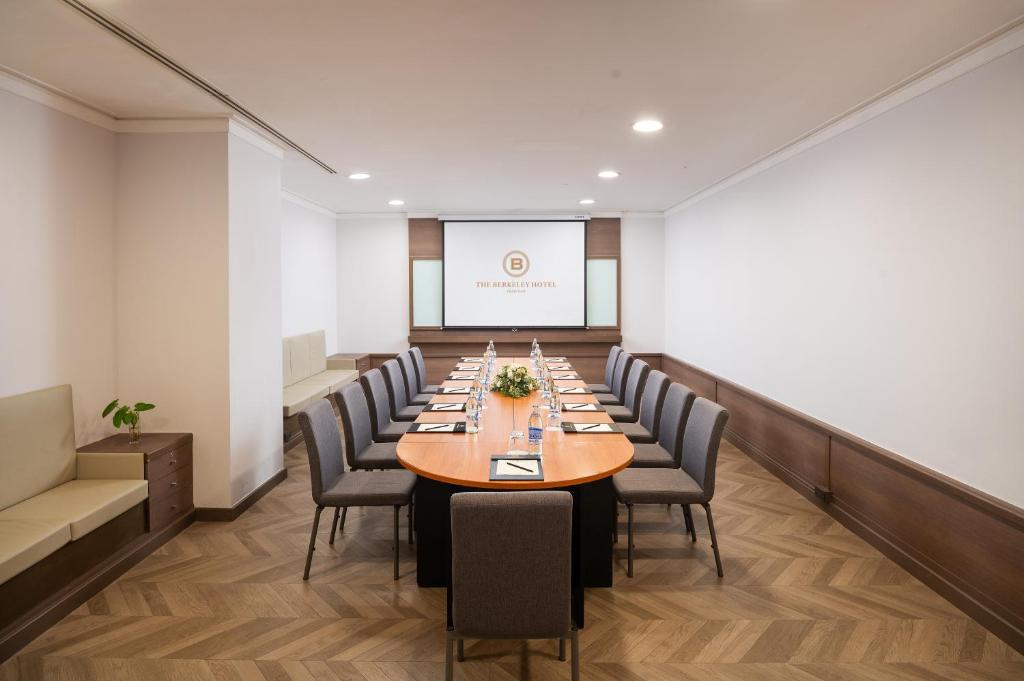 a conference room with a long table and chairs at The Berkeley Hotel Pratunam in Bangkok