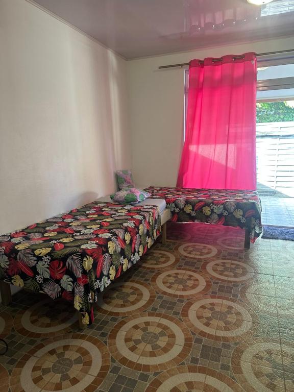 Postel nebo postele na pokoji v ubytování Vaiotaha Lodge