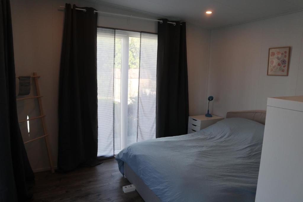 Postel nebo postele na pokoji v ubytování Tinyhouse