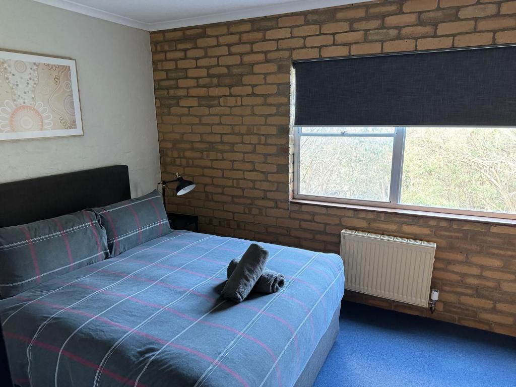 Кровать или кровати в номере Attunga Alpine Lodge & Apartments