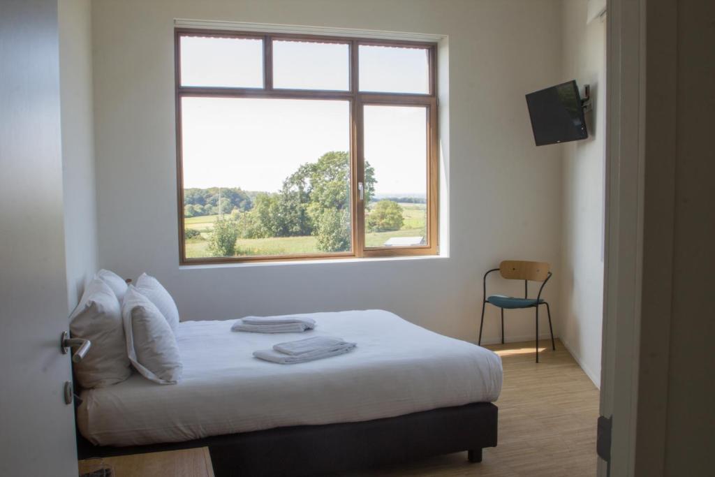 Postel nebo postele na pokoji v ubytování Hotond Sporthotel