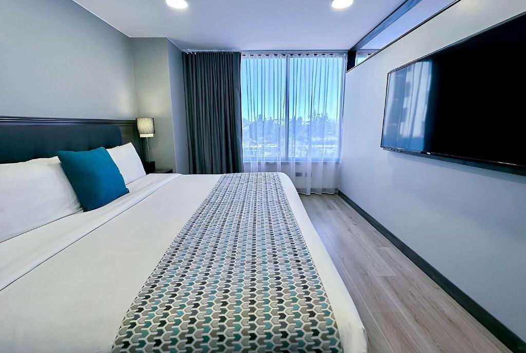 Postel nebo postele na pokoji v ubytování La Quinta by Wyndham Quito