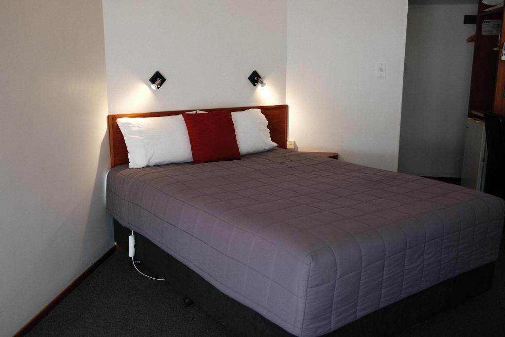 Postel nebo postele na pokoji v ubytování Gateway Motor Lodge - Wanganui
