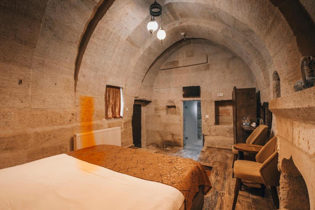 Postel nebo postele na pokoji v ubytování Sierra Cave Göreme Cappadocia
