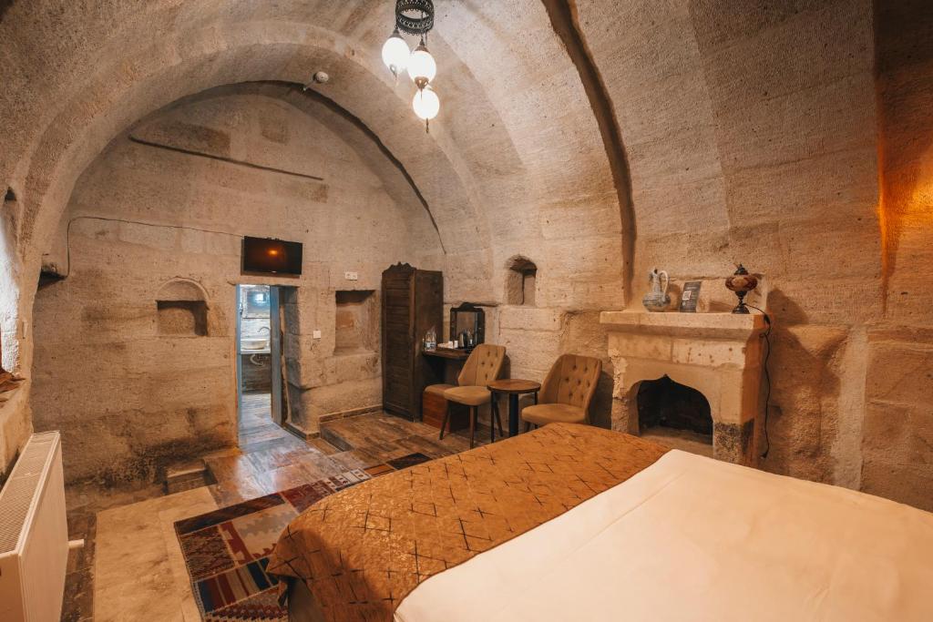 Postel nebo postele na pokoji v ubytování Sierra Cave Göreme Cappadocia