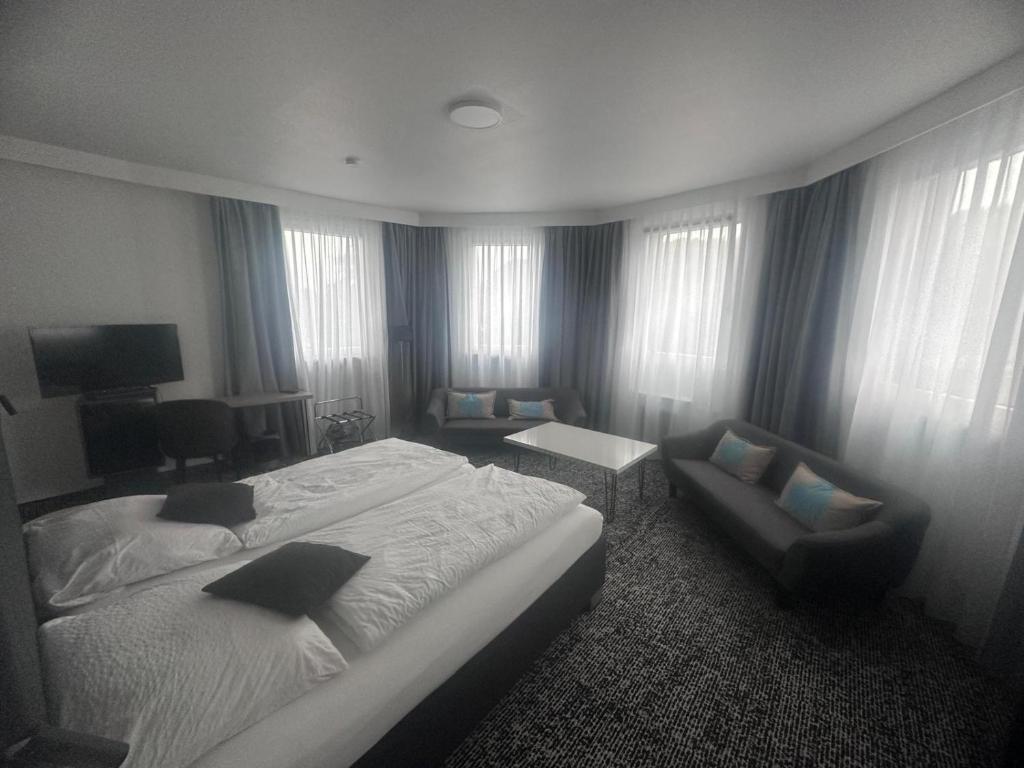 Postel nebo postele na pokoji v ubytování Panorama Hotel Rheinkrone