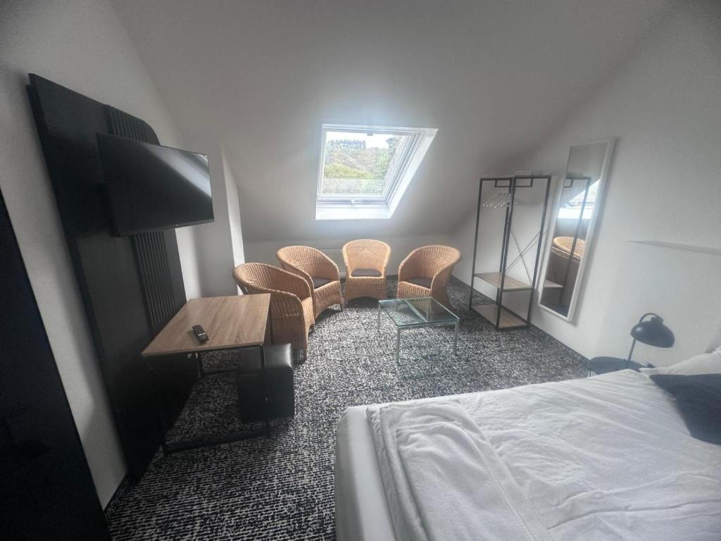 Postel nebo postele na pokoji v ubytování Panorama Hotel Rheinkrone