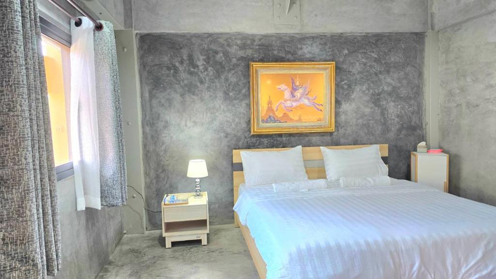 Postel nebo postele na pokoji v ubytování Captain Joe Cafe & Hostel