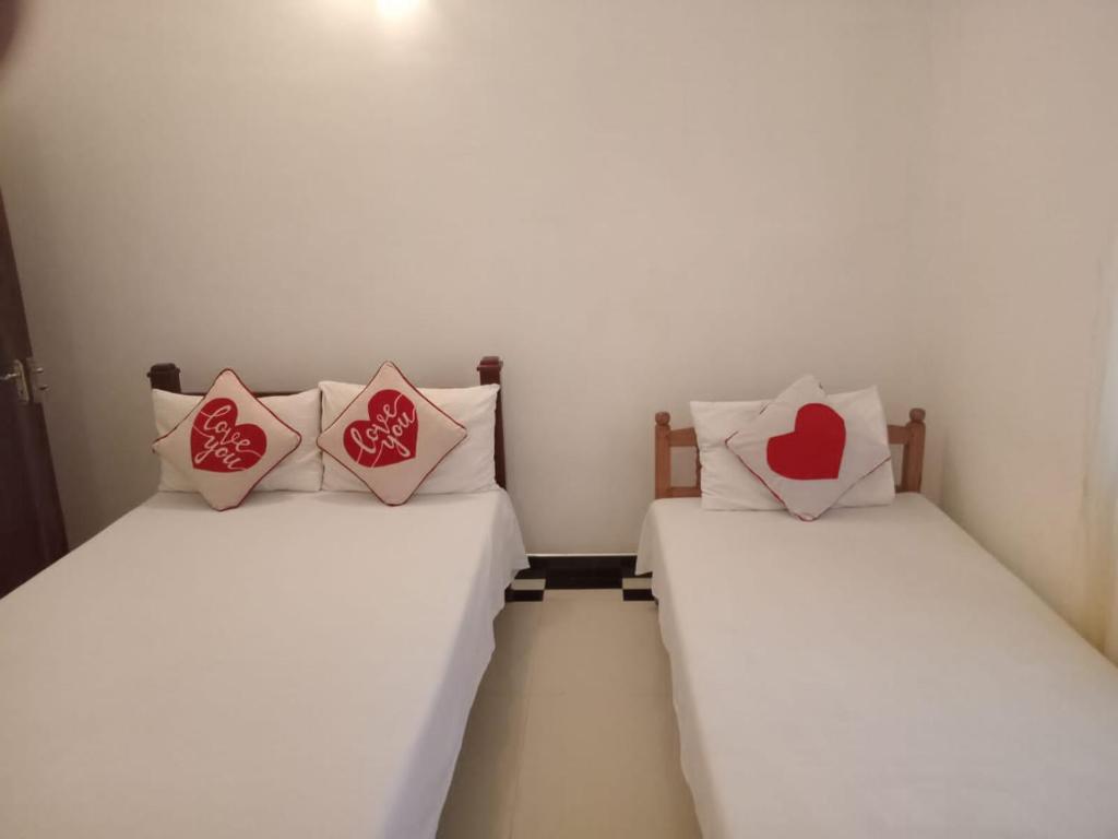 Postel nebo postele na pokoji v ubytování Mindi Guest