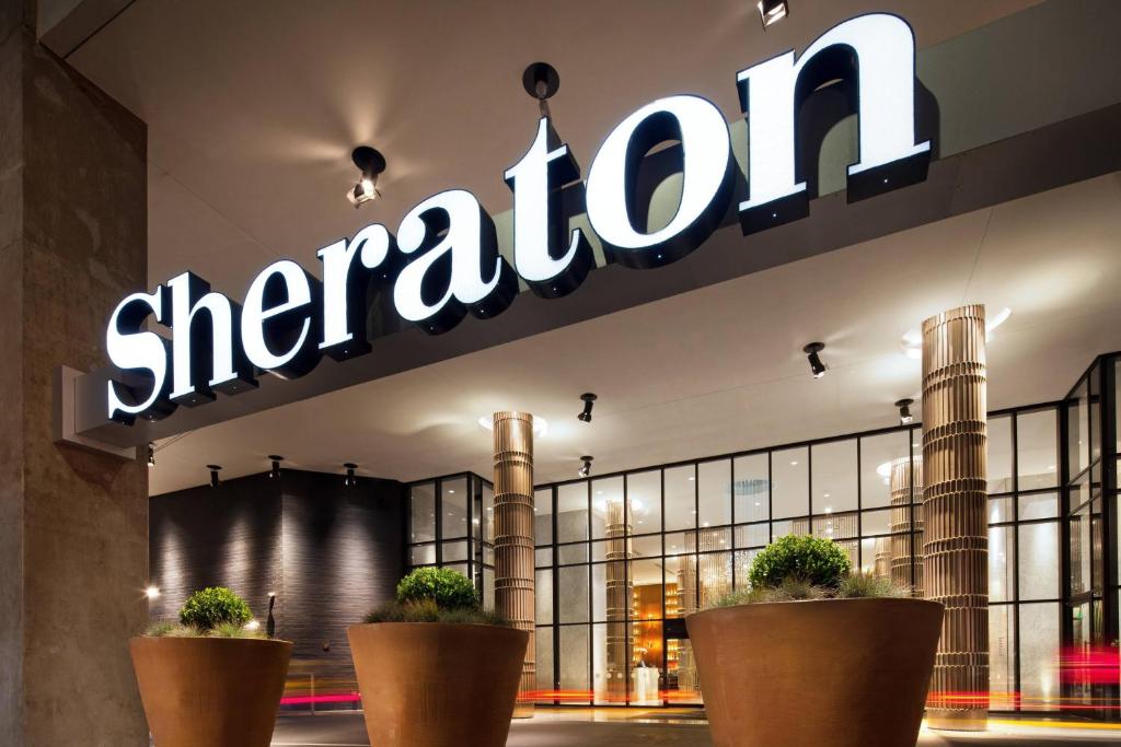 a cheetah store with potted plants in front of it at Sheraton Grand Los Angeles in Los Angeles