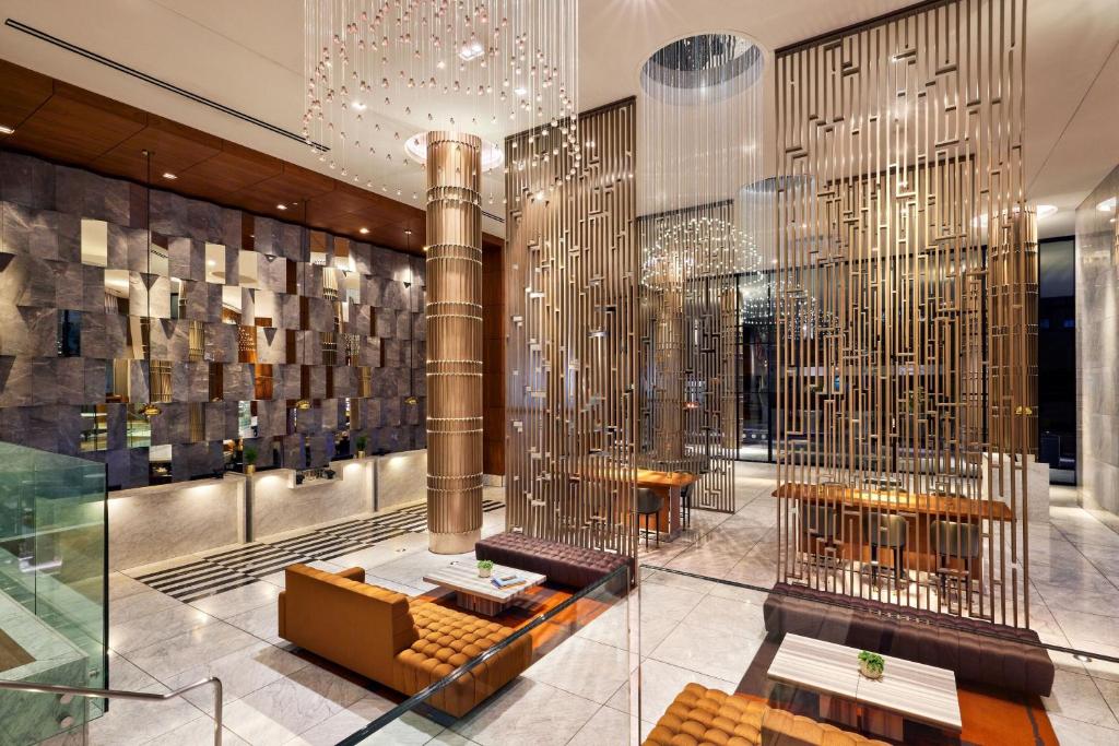 a lobby of a building with a chandelier at Sheraton Grand Los Angeles in Los Angeles