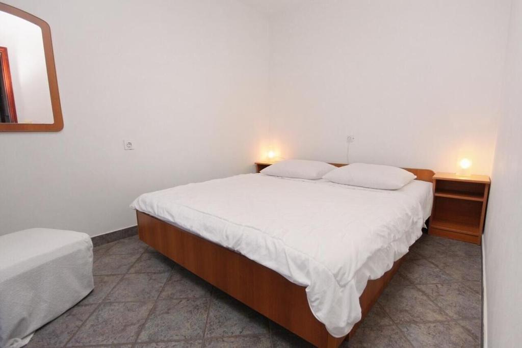 Posteľ alebo postele v izbe v ubytovaní Apartments Vala