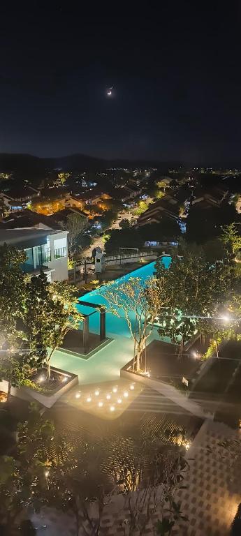 a view of a building at night with lights at HABITUS Elmina Denai Alam in Shah Alam