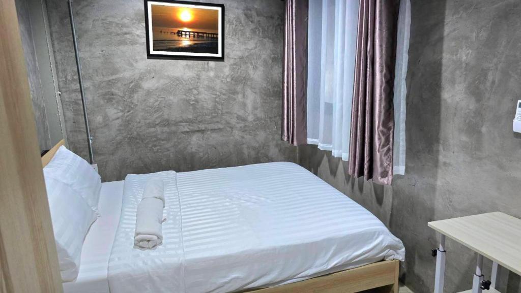 Postel nebo postele na pokoji v ubytování Captain Joe Cafe & Hostel