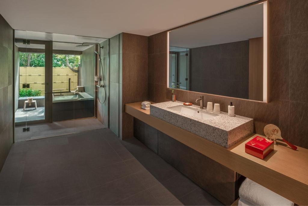 a bathroom with a sink and a mirror at Shisui, a Luxury Collection Hotel, Nara in Nara
