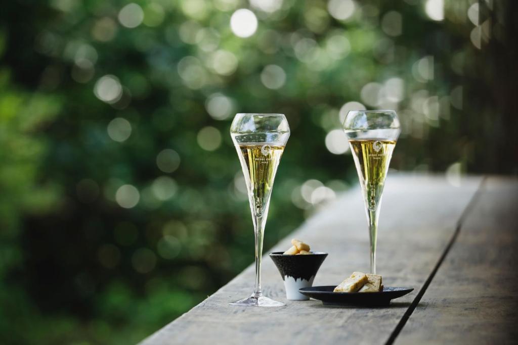 two glasses of champagne on a wooden table at Shisui, a Luxury Collection Hotel, Nara in Nara