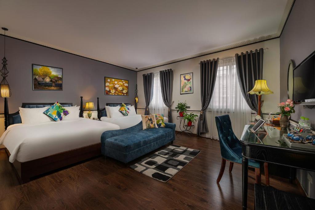Postel nebo postele na pokoji v ubytování Hanoi Garden Hotel & Spa