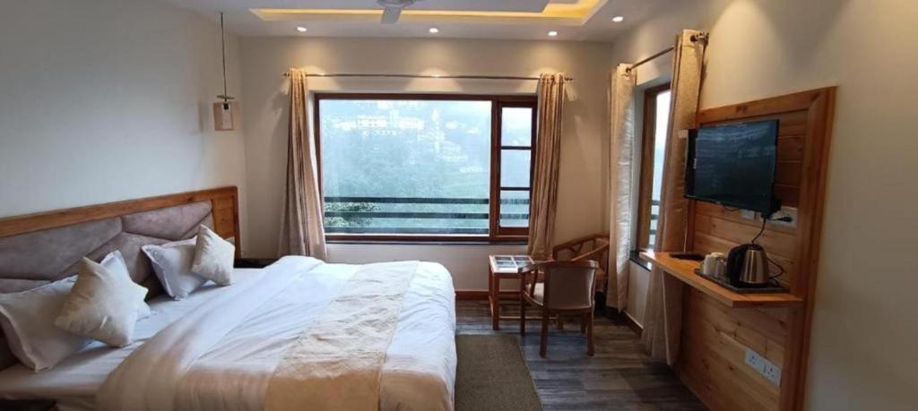 Voodi või voodid majutusasutuse The Boho Mussoorie toas