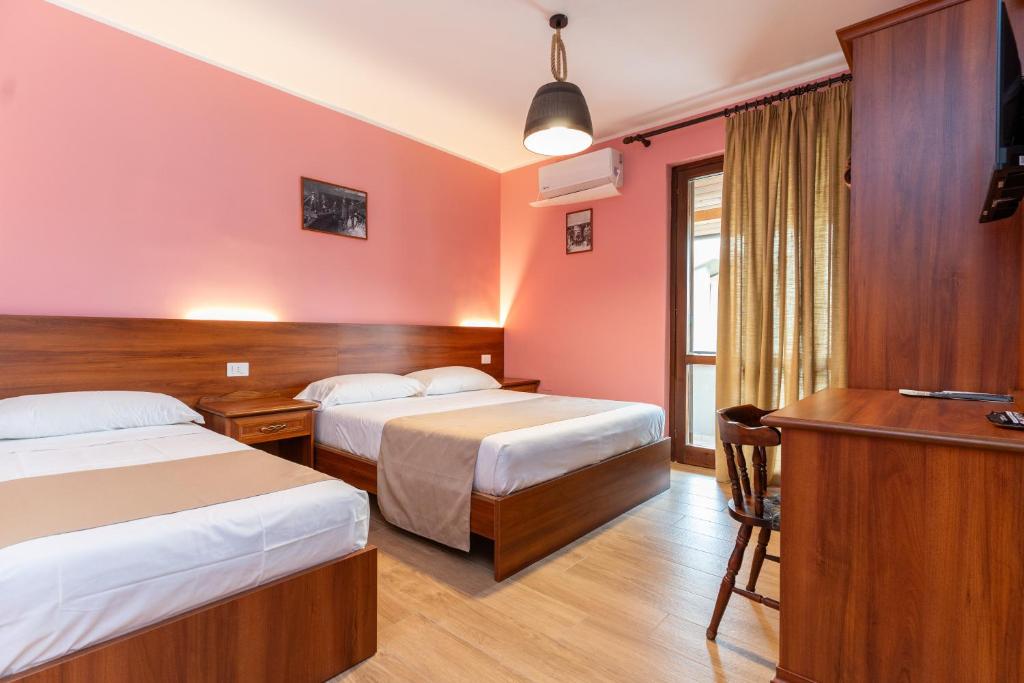 Postel nebo postele na pokoji v ubytování B&B Gusto West