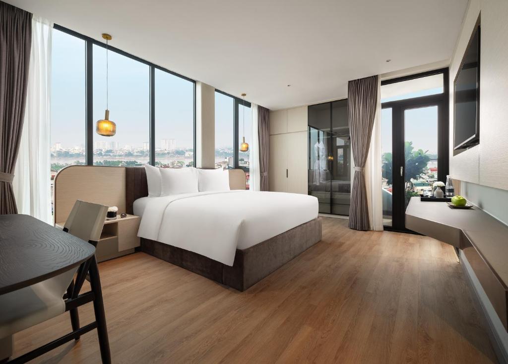 Giường trong phòng chung tại CLASSYC Hotel
