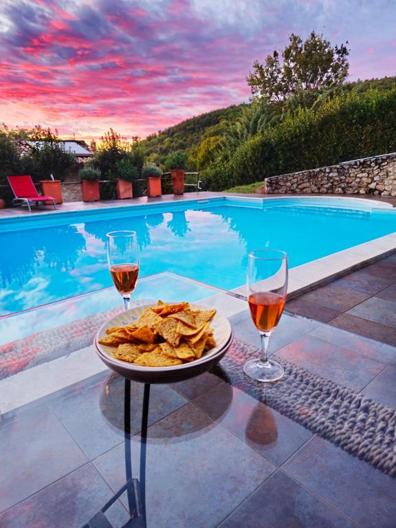 The swimming pool at or close to Villa delle lucciole