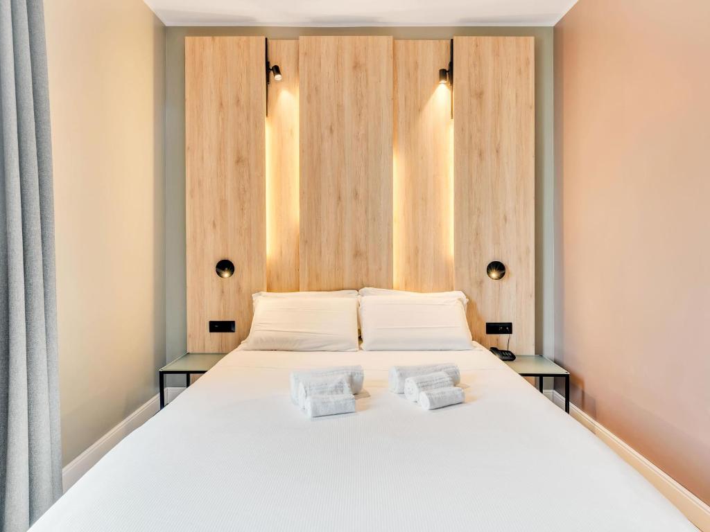 Postel nebo postele na pokoji v ubytování B&B Hotel Milano Aosta