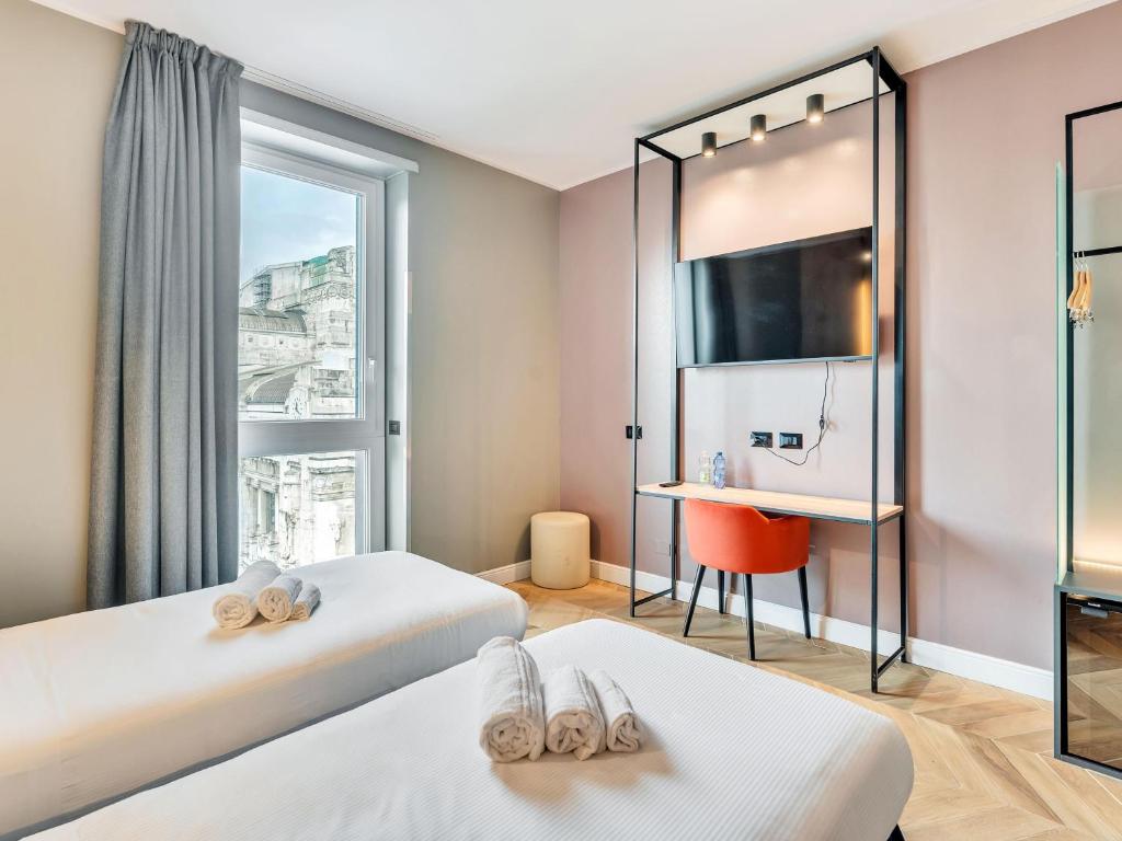 Postel nebo postele na pokoji v ubytování B&B Hotel Milano Aosta
