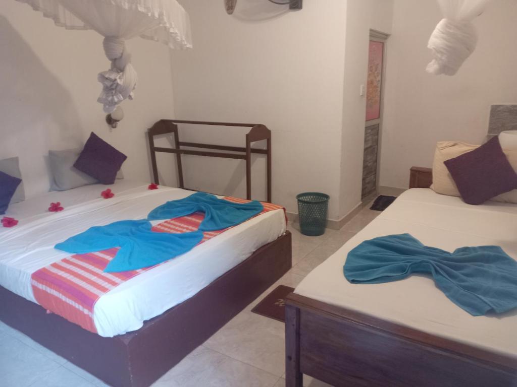 Postel nebo postele na pokoji v ubytování Kolon Resort Sigiriya