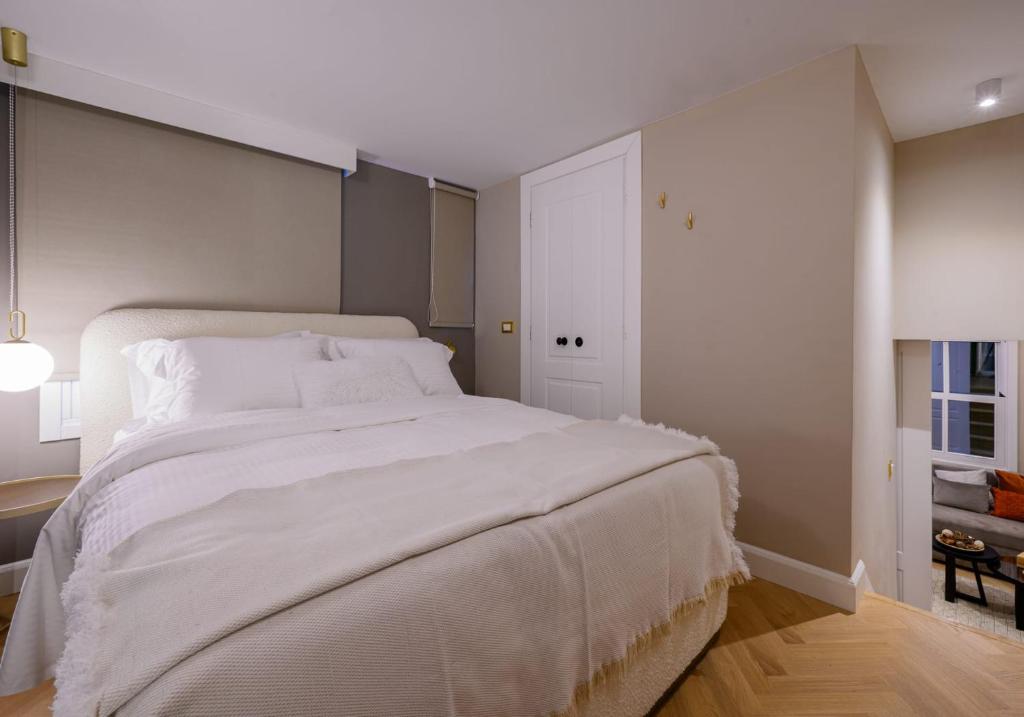 Postel nebo postele na pokoji v ubytování The Zorbas Apartments